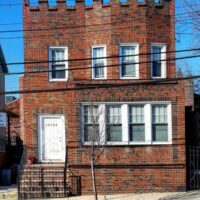 This is an image of a College Point Brick Apartment Building