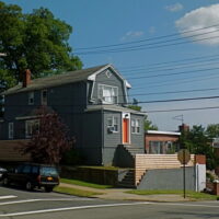 This is an image of a College Point House With Orange Door