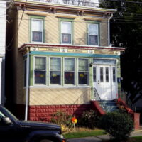This is an image of a College Point House With Mansard Roof