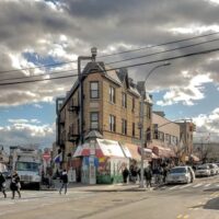 This is an image of a Corona Triangular Corner Apartment Building