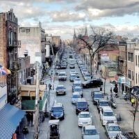 This is an image of a Corona Streetscape at 104th Street and Roosevelt Avenue