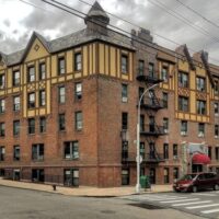 This is an image of Flushing Tudor Style Apartment Building