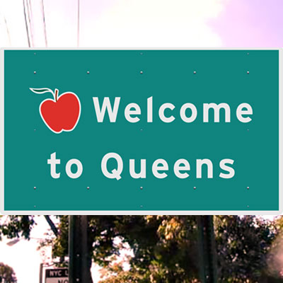 This is an image of a Welcome to Queens Road Sign