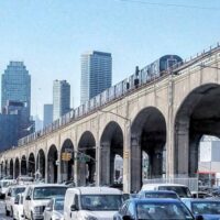 This is an image of Sunnyside With Elevated Train at Queens Blvd and 39th Place