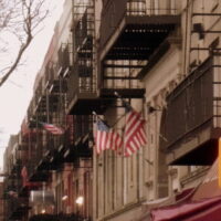 This is an image of Sunnyside building with American Flags