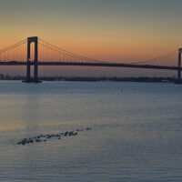 This is an image of Throgs Neck Bridge at dusk